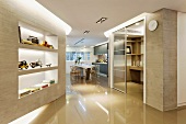 Built-in shelves clad in natural stone in a modern hall