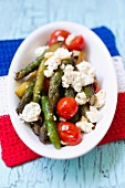 Green asparagus with cherry tomatoes and sheep's cheese