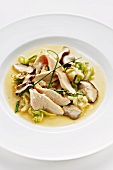 Lukewarm white cabbage salad with preserved mushrooms and marinated chicken breast