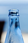 The neck of a blue bottle