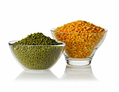 Mungo beans and yellow split peas in glass bowls