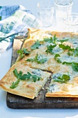 A grilled blue cheese and rocket pizza