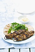 Beef kebabs with a garlic and mustard marinade and unleavened bread
