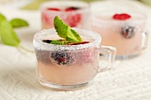 Pink Lemonade Spritzer with Fresh Berries in Small Glasses