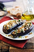 Baked aubergines stuffed with rice, mushrooms and crunchy breadcrumbs