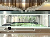 Modern lobby with floor to ceiling windows and decorative ceiling poles