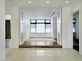 Empty modern home with white accordion doors