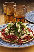 Chicken salad with parsley and pomegranate seeds on unleavened bread