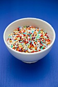 A bowl of colourful sugar sprinkles