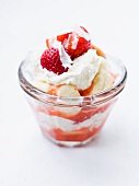 Strawberry tiramisu with white chocolate in a glass bowl
