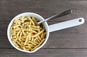 Spätzle (soft egg noodles) in a saucepan