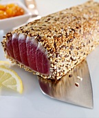 Tuna with a sesame seed crust on a knife