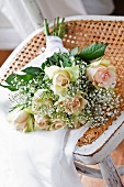 Arrangement of roses and gypsophila