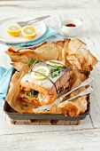 Baked salmon with lemons and herbs