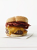 Bacon Cheeseburger on a White Napkin