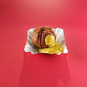A meat ball with sweet mustard