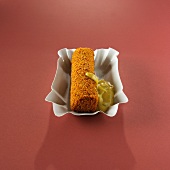 A meat croquette with sweet mustard (Holland)