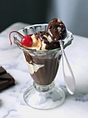 Ice Cream Sundae with Vanilla Ice Cream, Chocolate Sauce and a Cherry