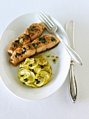 Baked Salmon with Yellow Squash Cake on a Plate