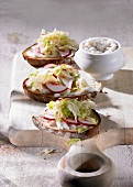 Brown bread topped with dripping and pointed cabbage salad