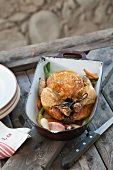 Braised chicken with vegetables in a roasting tin