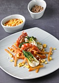 Sauteed prawns with carrots, bok choy and diced mango