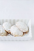 Kourambiedes (Greek almond shortbreads) in a small bowl