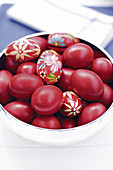 Eggs coloured red and decorated with flowers for Easter (Greece)