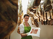 Woman with freshly cut ham