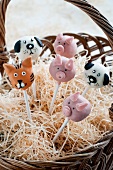 Cake Pops decorated as various animals in a basket