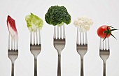 Close up of vegetables on forks