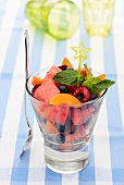 Fruit salad in a glass with mint