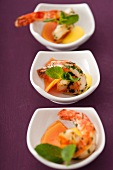 Bowls of antipasti: mango and scampi with coriander dressing