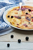 Apple and blueberry pancakes with a fork