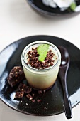 Panna cotta with matcha tea and chocolate biscuit crumbs