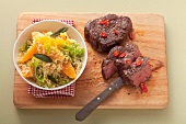 Beef steak and couscous with orange