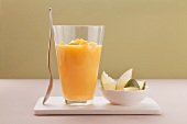 A pineapple and mango shake with coconut milk