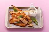 Oven-baked parsnips and a creme fraiche dip