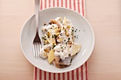 Soused herring with a creamy spiced sauce made with apples and yogurt