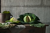 A sliced savoy cabbage on a wooden table