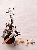 Chocolate sauce, chocolate pieces and almonds
