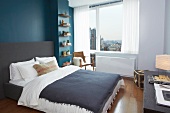 Bedroom with Blue Accent Wall; City Views