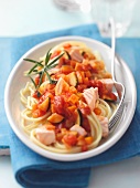 Spaghetti with salmon and vegetable sauce