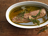 Pork fillet confit with oil and herbs