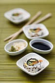 Sushi with wasabi, ginger and soy sauce