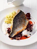 Sea bream fillet on a bed of radicchio with a potato salad