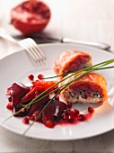 Fish rolls with a beetroot and pomegranate salad