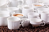 An arrangement of coffee with hot coffee and white crockery