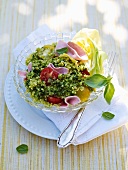 Bulgur salad with basil, ham and tomatoes