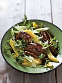 Salad with mango and fried beef